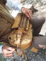 Someone is playing a hurdy gurdy